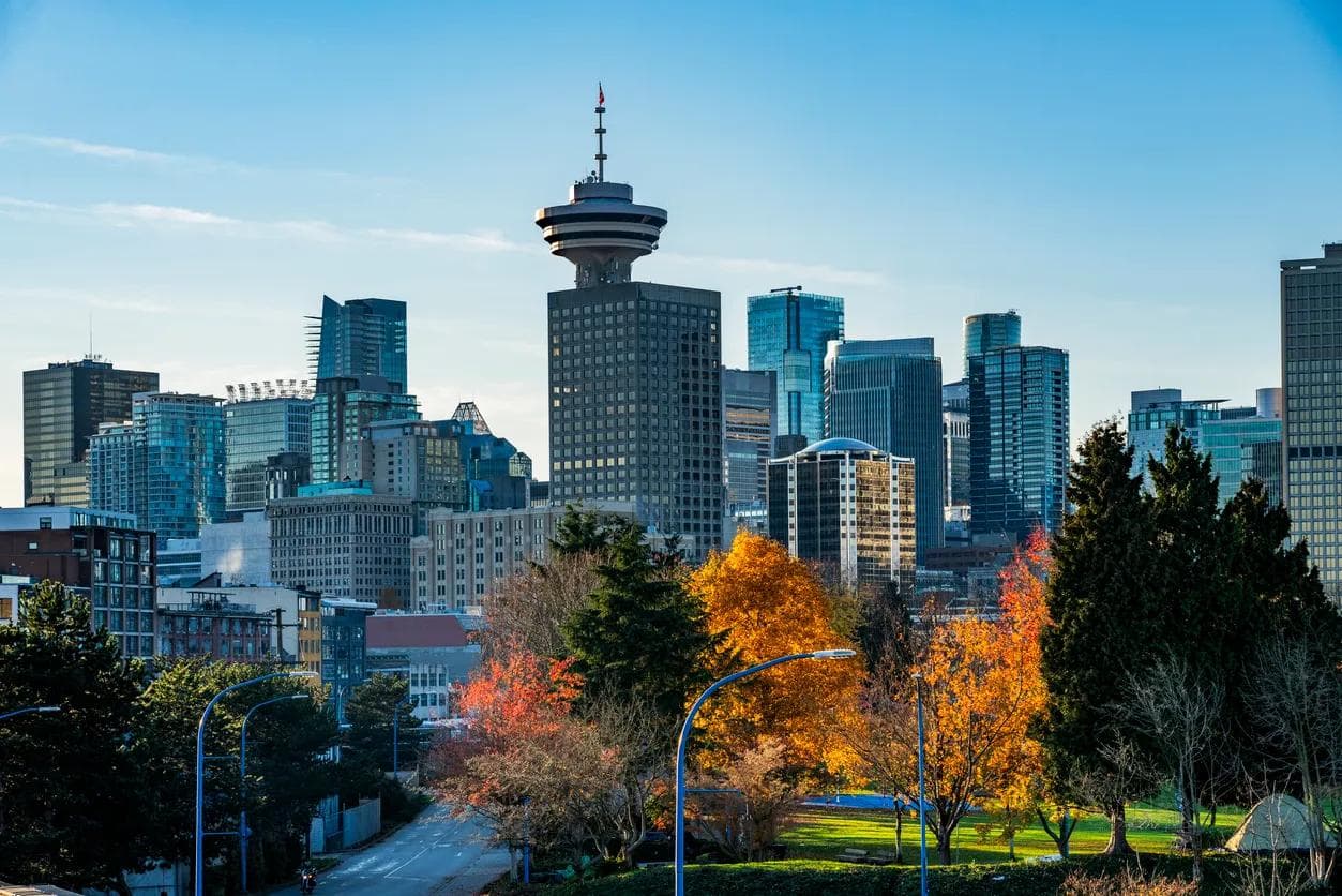 A view of modern skyscrapers and trees in Vancouver, Canada