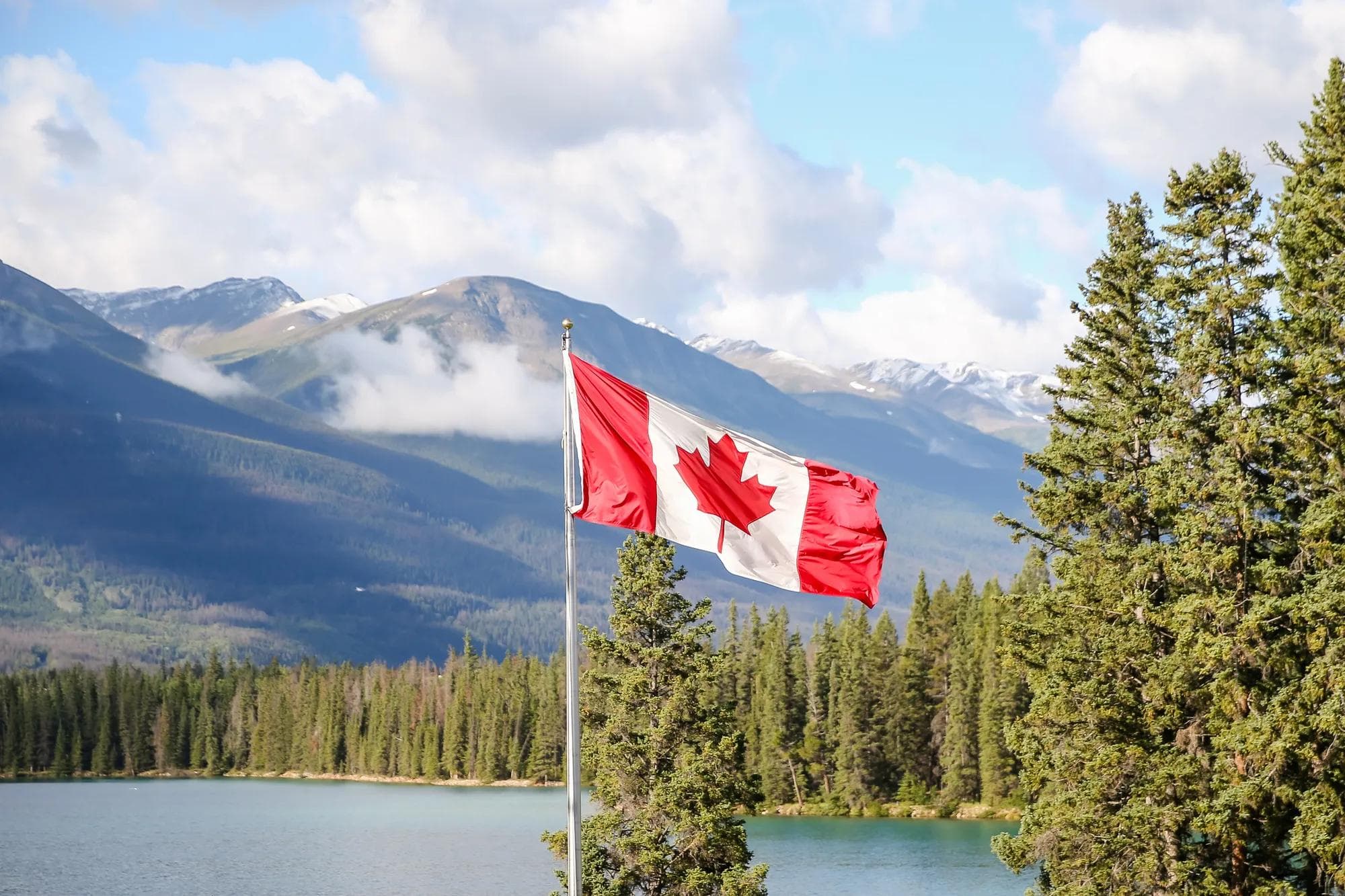 Canadian Flag with mountainous background