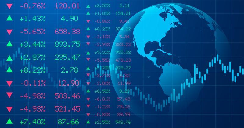 Digital charts and graphs displayed over world map