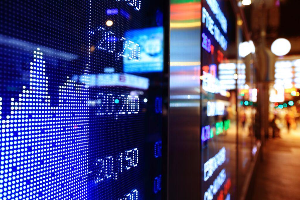 Image of a stock market board taken from a tight angle on the side