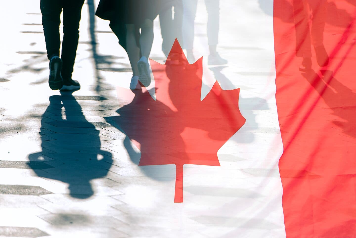 The National Flag of Canada and shadows of people