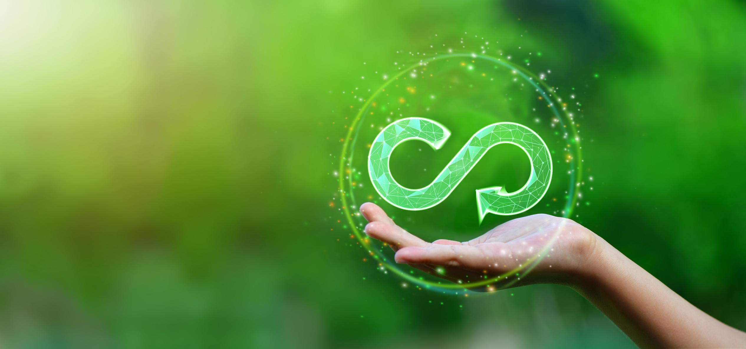 Businesswoman holding circular economy icon