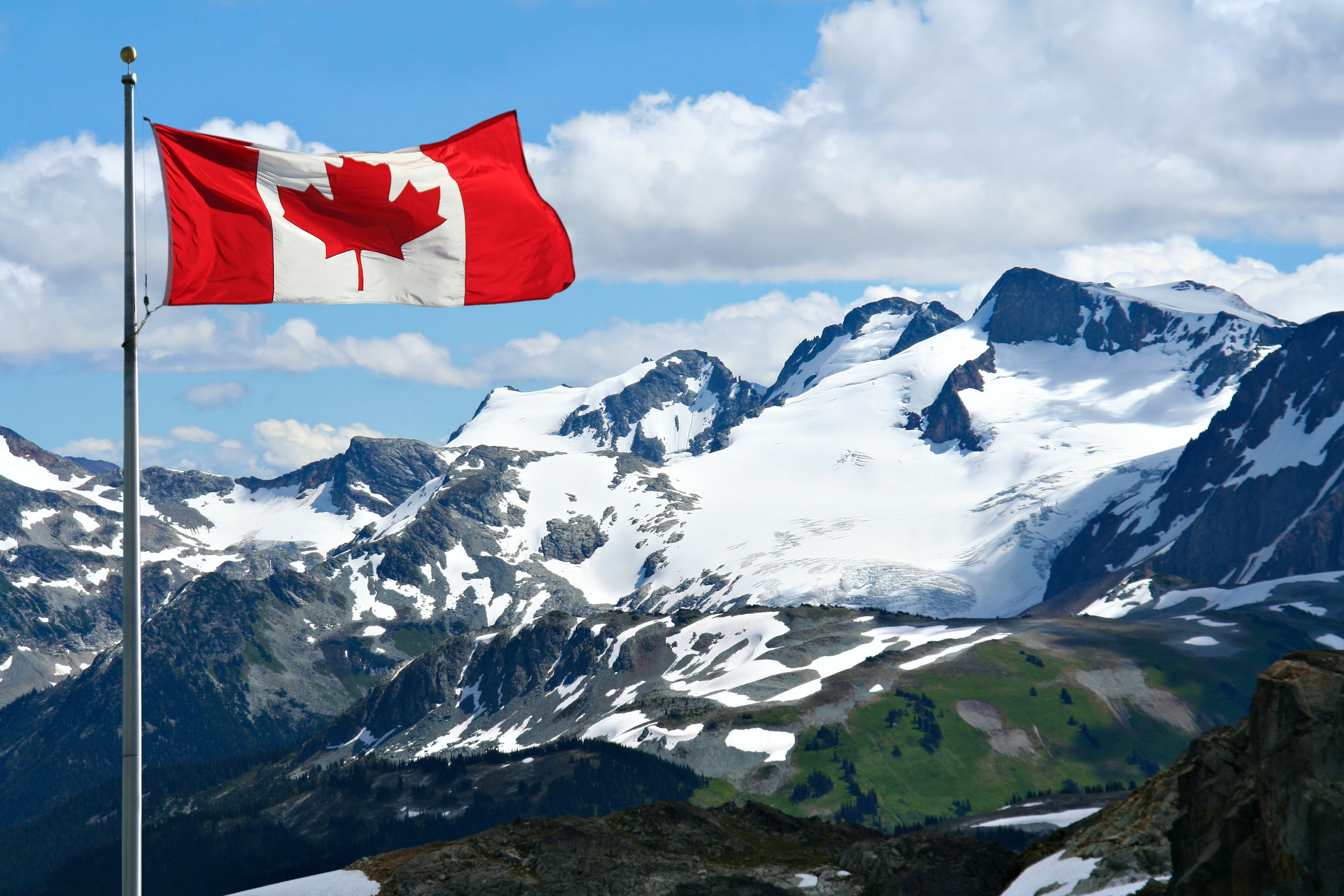 Canadian flag with mountains