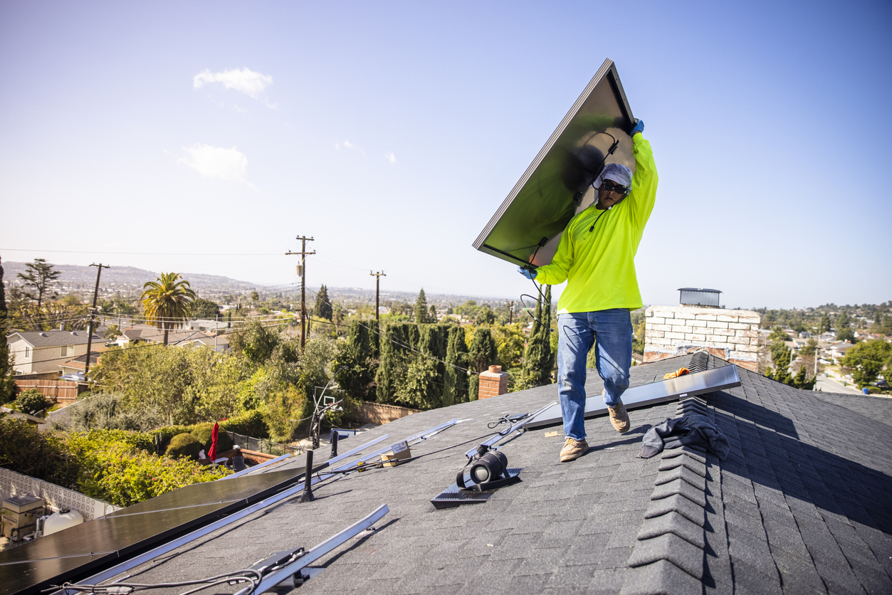 Workers installing solar panels