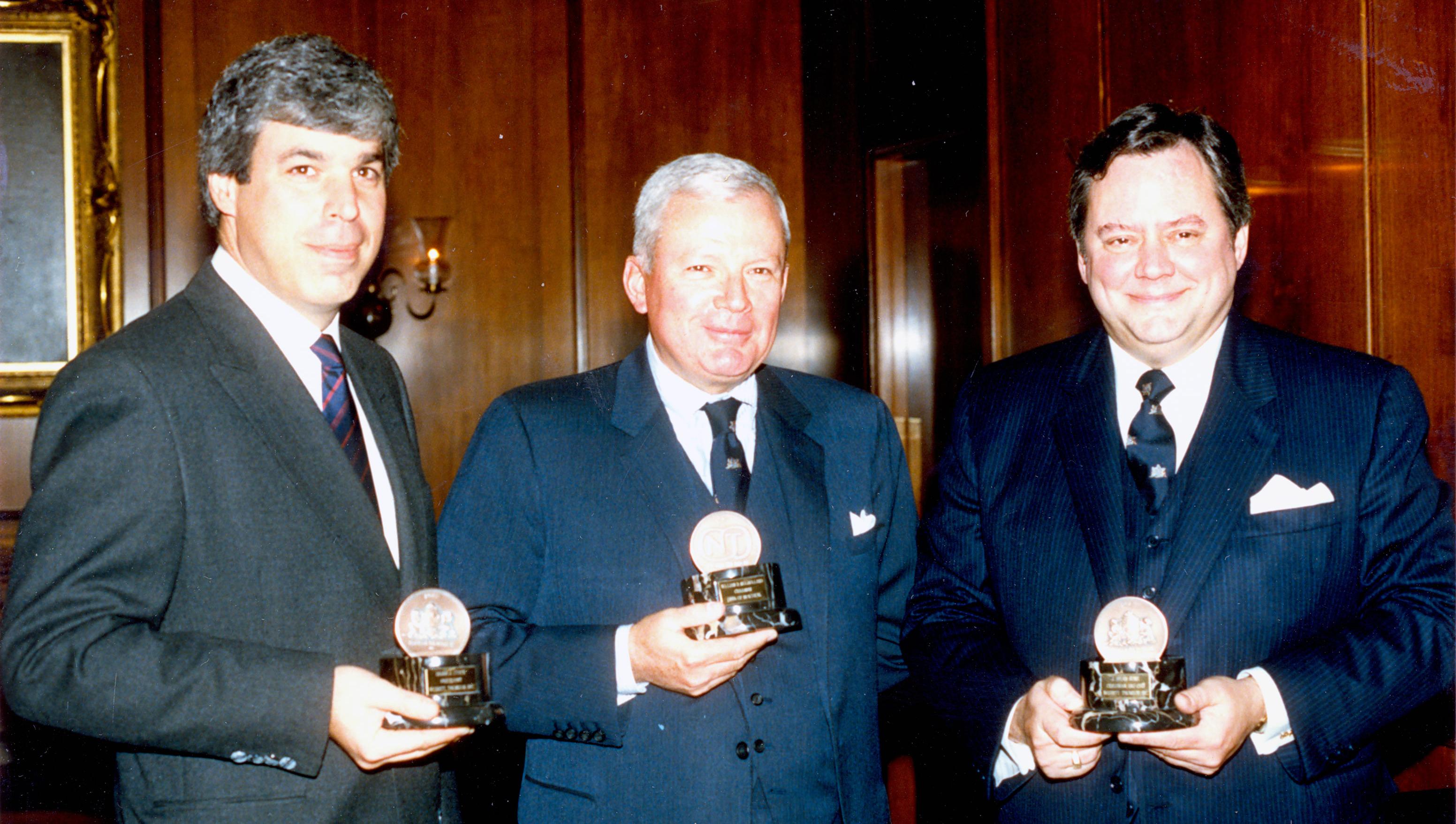 Brian Steck, President of Nebitt Thomson,  W.D. Mulholland, Chairman and CEO, Bank of Montreal, and J. Brian Aune, Chairman, Nesbitt Thomson, in October 1987 for the BMO Nesbitt Thomson merger.