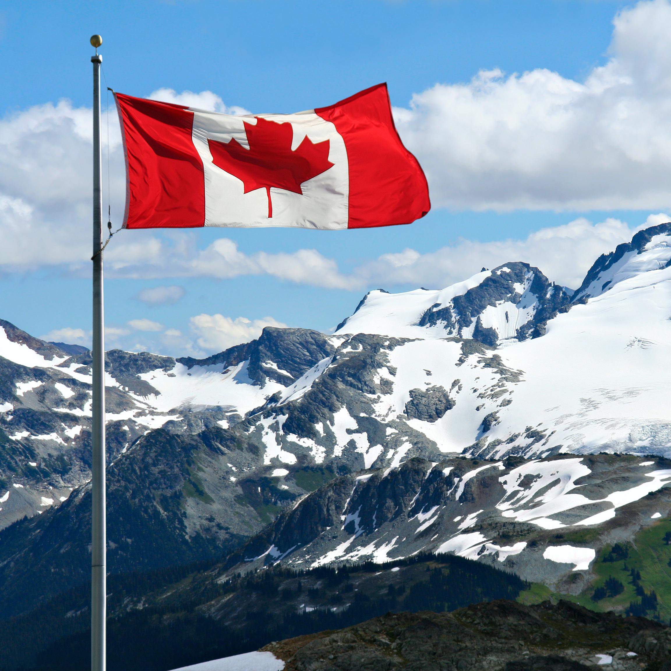 Canadian flag with mountains