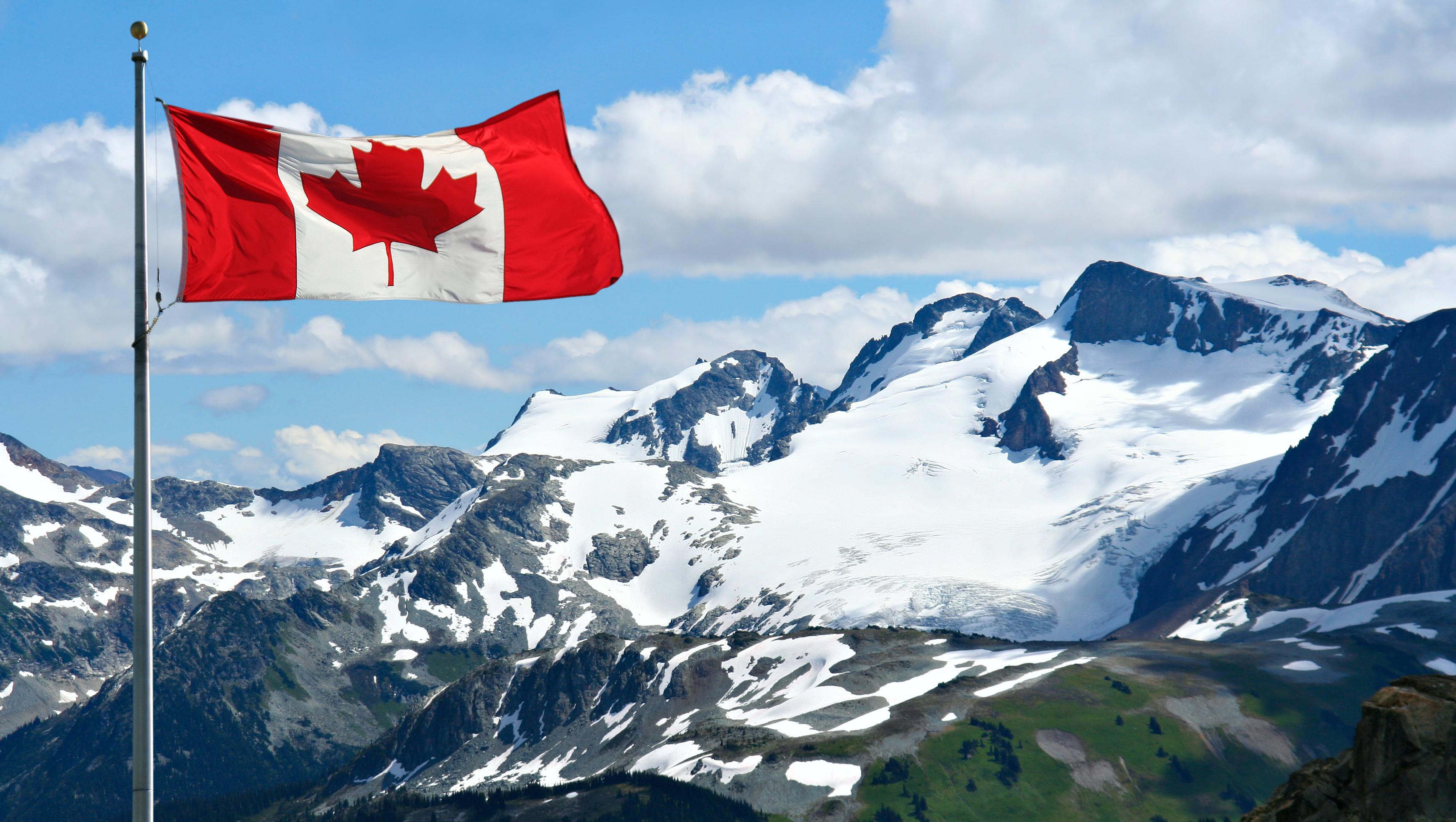 Canadian flag with mountains