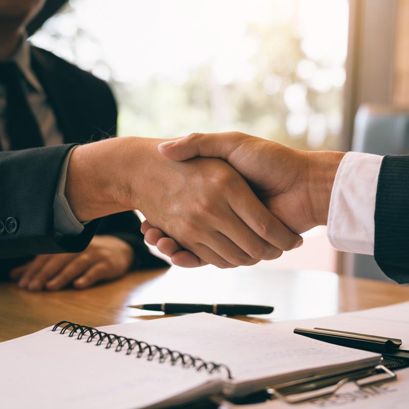 Two brokers shaking hands